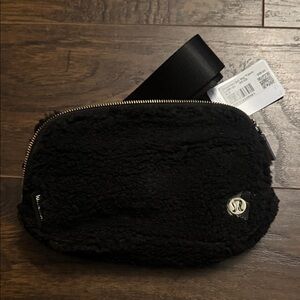 Lululemon Athletica Black Fleece Belt Bag w/Gold Hardware. NWT